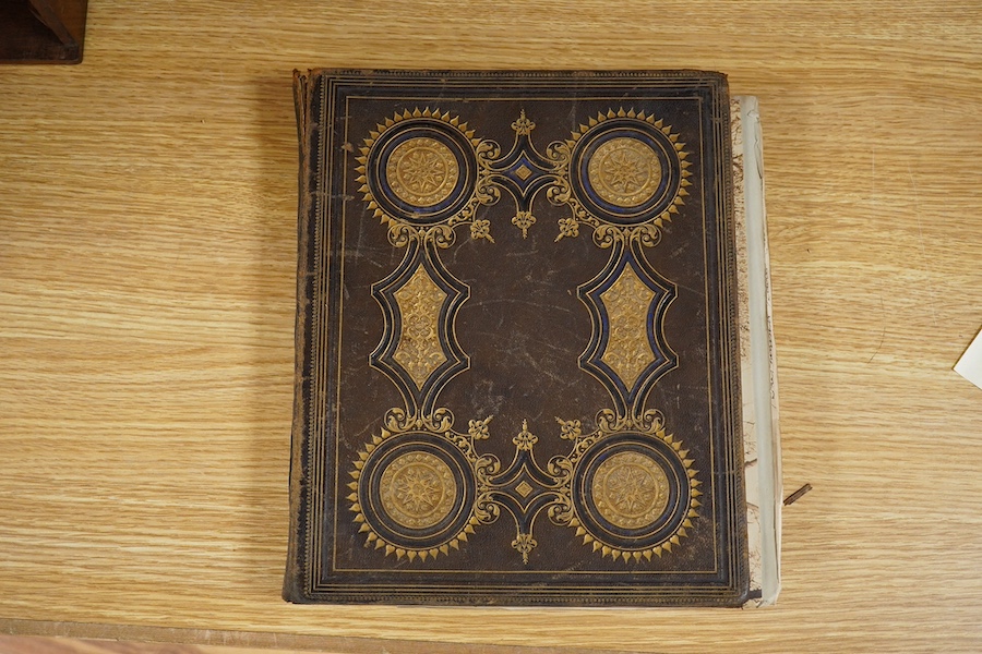 A Victorian photograph album; assorted portraits (many named) and views of India, many dated c.1860's. Condition - album spine torn, contents fair